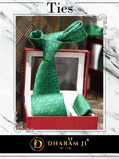 A stylish green patterned tie and pocket square set, perfect for adding a touch of personality to a formal or semi-formal outfit.