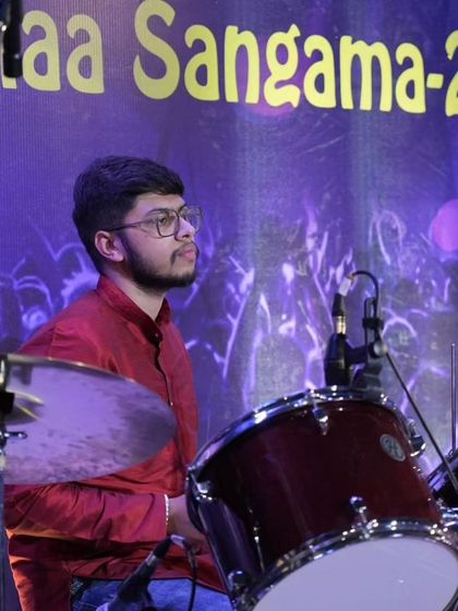 Our student drummer providing the beat for a Shiva Bhajan performance.