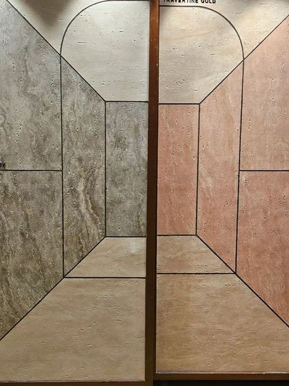 A display of 'Travertine' finish Ittimi panels. The clever graphic design creates a 3D illusion of depth, adding a unique artistic touch.
