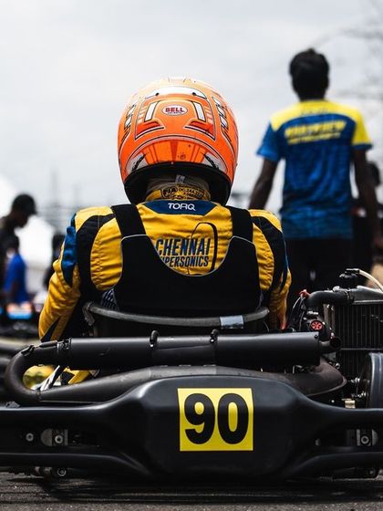 A rear view of a driver on the grid, waiting for the start.