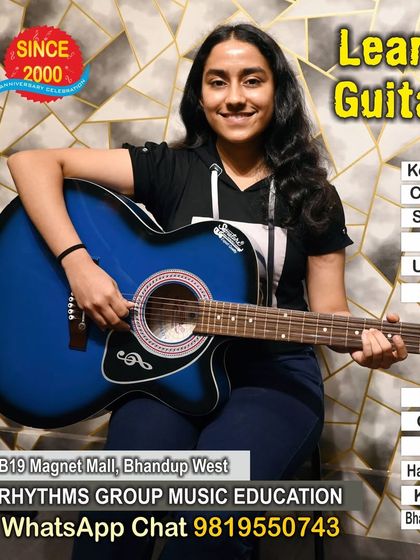 We offer lessons for various types of guitars, including the popular acoustic guitar. This student is learning to play a beautiful blue acoustic, ready to start her journey with our structured guitar course.