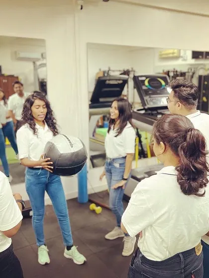 Continuous learning is a core value at Arch. A team member leads a practical session, ensuring we are all proficient in the latest exercise methodologies to better serve our clients.