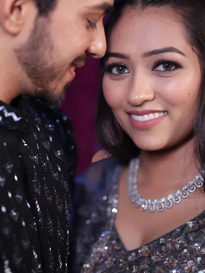 A close-up of the Sangeet couple. Her makeup is soft yet glamorous, with a focus on luminous skin that looks incredible in the evening lights.