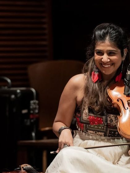 A close-up of Apoorva Krishna during a performance at Windmills. Her ability to convey deep emotion through her violin is truly special.