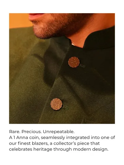 The smallest details make the biggest difference. Here, I've integrated a genuine 1 Anna coin from historic India as a button on one of our finest blazers. It’s a collector’s piece that turns a piece of currency into couture, celebrating our heritage in a modern way.