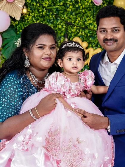 A charming 'Little Man' themed first birthday party, with a sophisticated black and white color scheme, mustache props, and a stylish backdrop, perfect for a dapper celebration.