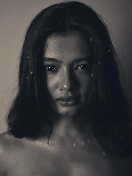 This monochrome series was about capturing a dreamlike, otherworldly feeling. The direct gaze is haunting and powerful.