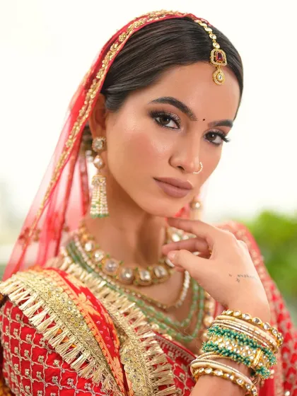 A stunning close-up under the veil. The focus is on the eyes, which are beautifully defined to stand out, creating a captivating and memorable bridal portrait.