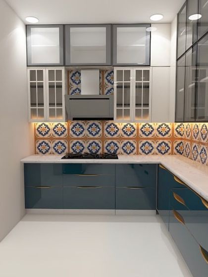 For this villa project, we designed a high-gloss PU kitchen with a vibrant Moroccan tile backsplash. The extensive use of glass shutters helps showcase beautiful crockery and makes the space feel open.