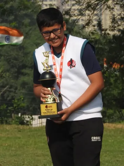 Another proud participant from the tournament, happy with his performance and trophy.