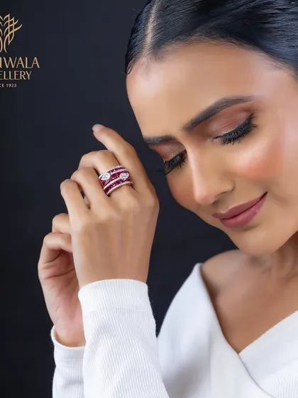 A contemporary design featuring bands of rich red rubies and sparkling diamonds. This ring is for the woman who is confident and unafraid to express her style.
