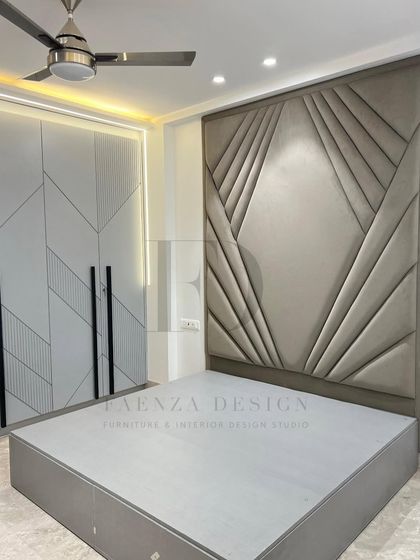 A bed with a magnificent, full-height headboard featuring an Art Deco-inspired, fan-like tufted pattern. This piece is designed to be the undeniable artistic centerpiece of a master bedroom.