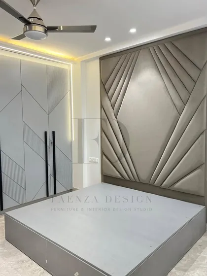 A bed with a magnificent, full-height headboard featuring an Art Deco-inspired, fan-like tufted pattern. This piece is designed to be the undeniable artistic centerpiece of a master bedroom.