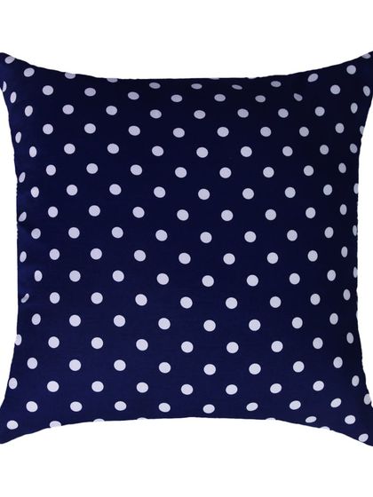 A navy blue and white polka dot square cushion, shot flat on a white background.