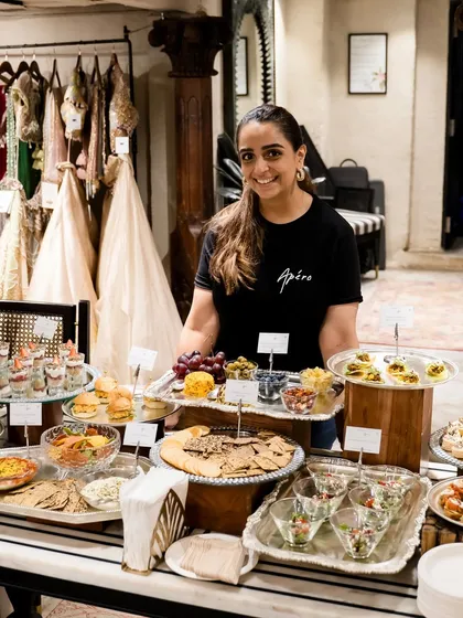 Here I am at the Gazal Gupta event, standing proudly behind a table laden with appetizers, dips, and desserts. It was a pleasure to cater for such a stylish affair.