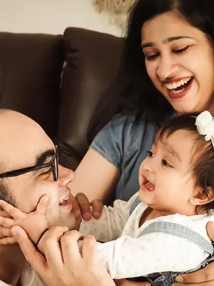 A baby's laughter is the best sound in the world. We captured this beautiful, candid moment of a family enjoying their time together in our studio.