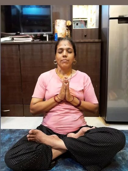 A beautiful moment of my mom in a seated meditation pose. Yoga is not just about physical postures; it's about finding inner peace and stillness.