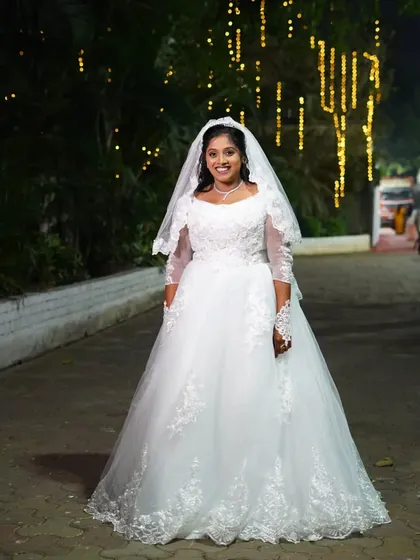For my Christian brides, I create looks that are elegant, timeless, and absolutely beautiful. This full-length view shows how the soft, natural bridal makeup and simple hairstyle come together with the white gown for a truly angelic appearance.