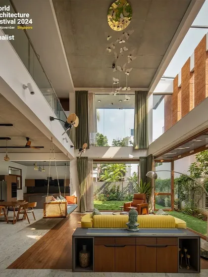 The open-plan layout connects the living, dining, and outdoor spaces, creating a fluid and interactive family home.