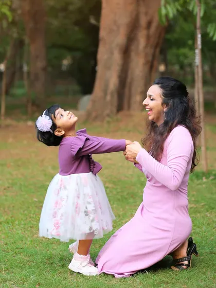 A playful moment between mother and daughter during their outdoor family session. My goal is to make the session feel like playtime to get these genuine smiles.