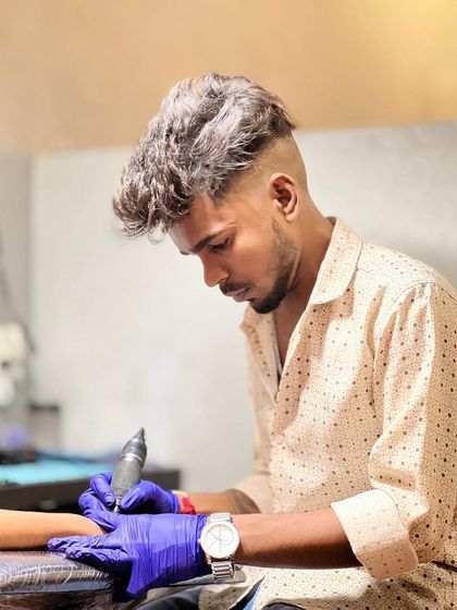 Artist Parseya in the zone, working on a new piece. Our team is passionate about bringing your vision to life.