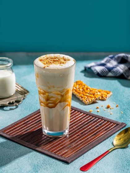 A peanut chikki (brittle) flavored milkshake, an innovative take on a traditional Indian sweet.