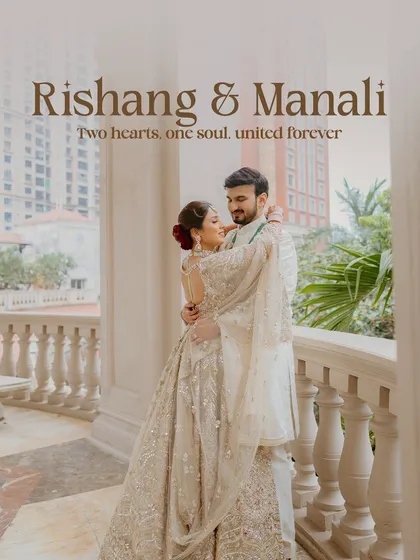 A beautiful and elegant portrait of the couple on a balcony overlooking the city. Their coordinated white outfits exude sophistication and grace.