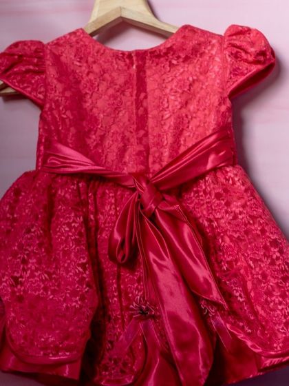This vibrant red dress is all about texture and volume. I used a beautiful floral lace fabric and a satin sash to create a dress that's full of energy and perfect for a festive occasion.