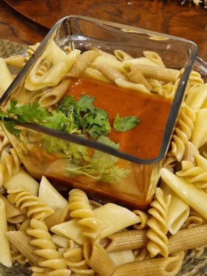 A deconstructed presentation of our Penne Pomodoro. We serve the pasta and our slow-cooked tomato and basil sauce separately, so you can mix them to your liking.