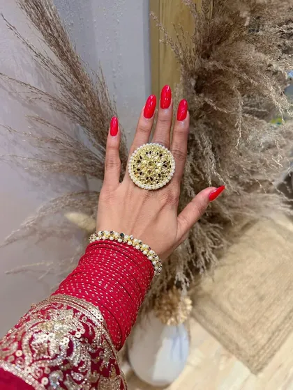Getting ready for Diwali with these festive red nails. The bright, classic red is the perfect accessory for any traditional outfit.