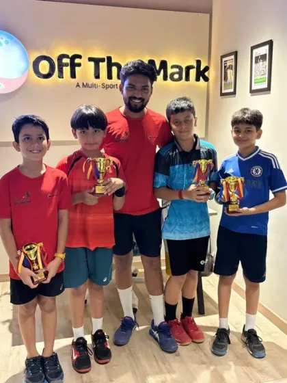The top four players from our Yellow Batch league with their coach and trophies. A proud moment for the academy.