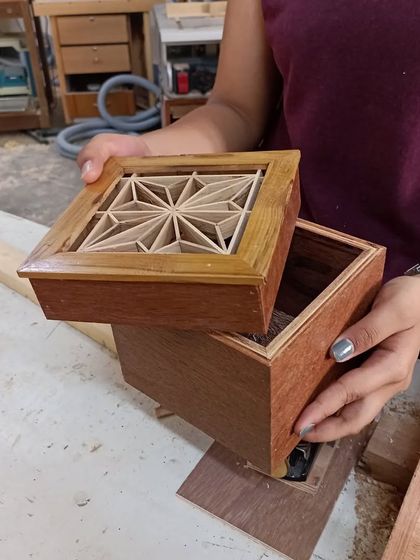 The finished Kumiko box, with its lid removed to show the clean construction. The box itself is made from a rich, dark wood, which contrasts beautifully with the light-colored Kumiko pattern.