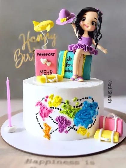 A stunning travel-themed cake featuring a handcrafted fondant figurine, a world map, and luggage. This is my German Chocolate flavour.