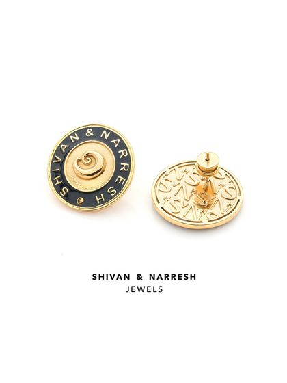 The 'Everyday Elegance Studs' from the Numisma collection by Shivan & Narresh. Featuring the brand's logo and signature enamel work, these are designed for the modern minimalist.
