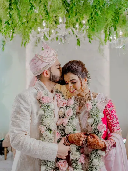 A gentle forehead kiss during the wedding ceremony. These moments of tenderness amidst the rituals are what make a wedding story so personal and beautiful.