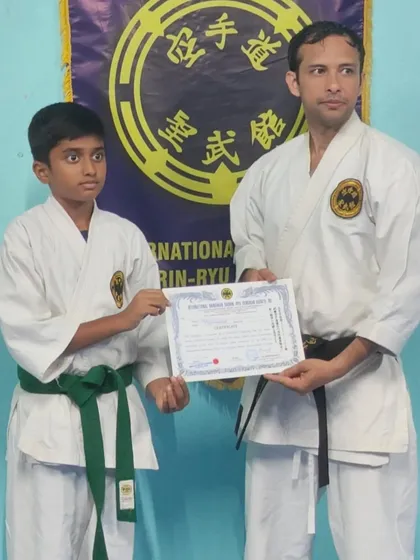 This young student has earned his 4th Kyu (green belt). His journey is a great example of the character development that comes from traditional karate training.