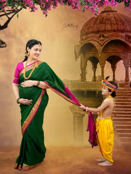 A playful moment in our Krishna-themed shoot, where the older brother, dressed as Krishna, pulls on his mother's saree. This captures the beautiful and dynamic relationship within the family.