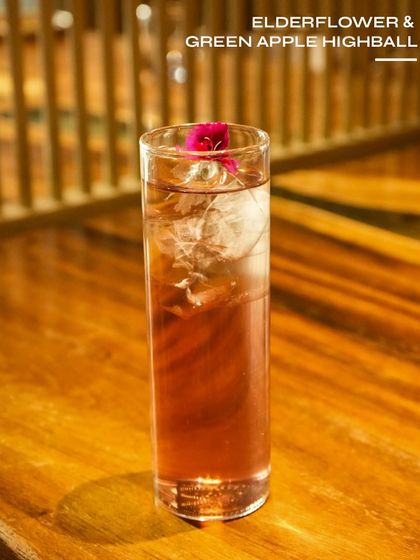 An Elderflower & Green Apple Highball, a light and floral drink. The combination of elderflower and crisp green apple makes for a perfectly refreshing sipper.
