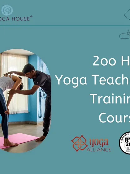 This image captures the essence of our hands-on approach. An instructor provides a gentle adjustment, ensuring the student finds the correct alignment in a forward bend, a fundamental part of our teaching methodology.