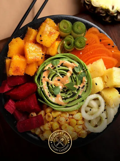 A vibrant and healthy poke bowl, beautifully arranged with an avocado rose, corn, beetroot, pineapple, and other fresh ingredients. A perfect light and modern option for any event.