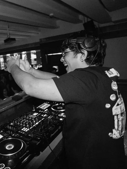 Hyping up the crowd is a huge part of my performance. This shot captures the energy and interaction that I bring to every set.