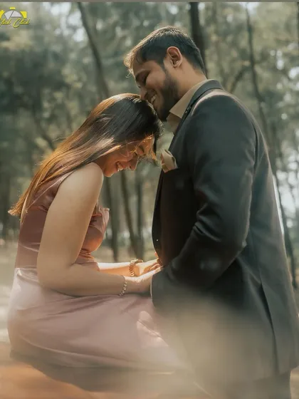 A soft, romantic moment shared between a couple during their vintage car pre-wedding shoot. The forest setting and gentle light add to the dreamy atmosphere.