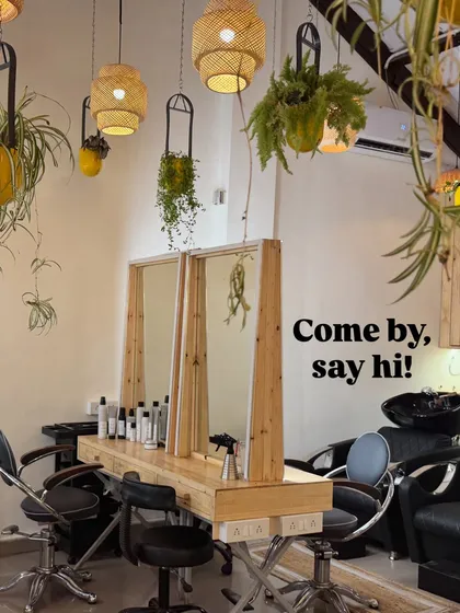 Welcome to our green sanctuary. I designed the salon to feel like a breath of fresh air in the middle of Mumbai, with hanging plants and furniture made from upcycled wood. Come by, say hi, and just relax with us.