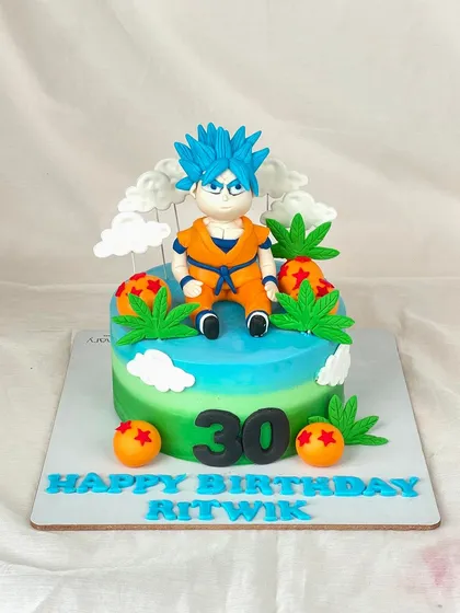 Powering up for Ritwik's 30th birthday with this Dragon Ball Z cake. It features a hand-sculpted Goku, ready for action on a colorful, two-toned cake.