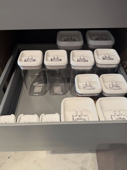This drawer is for airtight pantry containers. We organize them by size and shape, ensuring the drawer closes smoothly and you can always find the container you need.