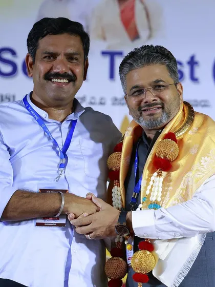 A moment of mutual respect and camaraderie at a public event. Building strong relationships within the community is essential for effective leadership.