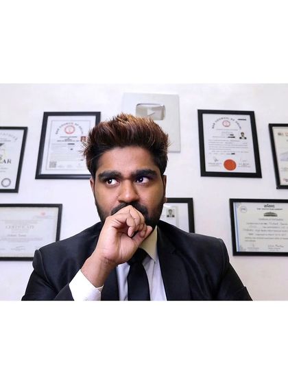 In my office, surrounded by my qualifications. These are not just certificates; they are the weapons in my arsenal.