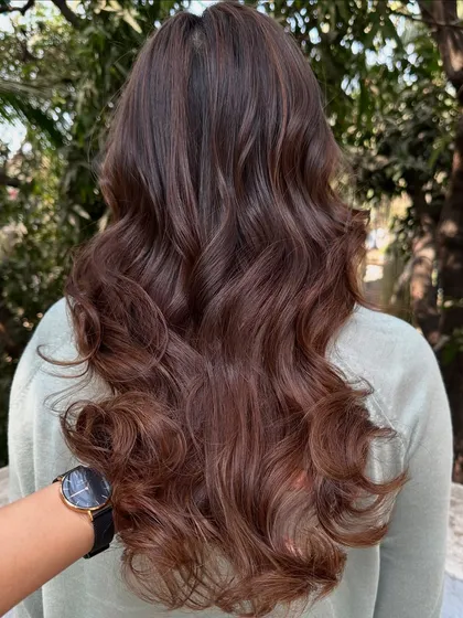 This is my 'Chocolate Pecan Dream' creation. We started with a faded base and gave her this incredibly rich, warm brown with delicate pecan highlights. The result is a glossy, healthy-looking color that’s perfect for any season.