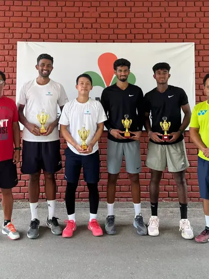 The winners' circle from the Chandigarh AITA Men's tournament, with our player Suraj Prabodh holding his singles and doubles trophies. Success like this is a result of consistent, high-intensity training.