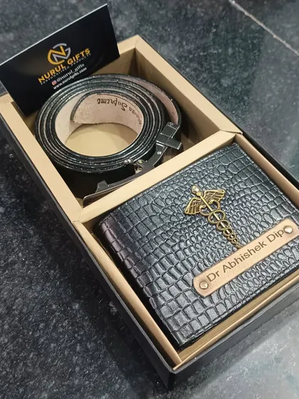 The gift set for a doctor, including the personalized crocodile wallet and a matching name-engraved belt, presented in a gift box.